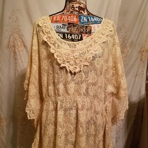 A off white batwing lace blouse...